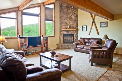 Spacious living room with gas fireplace and a view